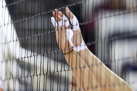 THESSALONIKI, GREECE  - FEBRUARY 15, 2014 :  Hands on net during the Hellenic Volleyball League game Paok vs Olympiacos at PAOK Sports Arena. Shallow dof.のeditorial素材
