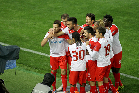 THESSALONIKI, GREECE MAR 9, 2014 : Players of Olympiacos celebrating their goal during the Greek Superleague match PAOK vs Olympiacos on March 9, 2014のeditorial素材