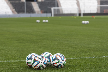 THESSALONIKI, GREECE MAR 9, 2014 : Balls on the field before the Greek Superleague match PAOK vs Olympiacos on March 9, 2014のeditorial素材