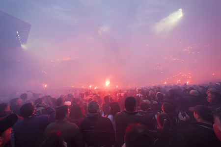 THESSALONIKI, GREECE APRIL 16, 2014 : View of the Toumba Stadium full of fans and supporters of PAOK who light flares during the Greek Cup Semi Final match PAOK vs Olympiacosのeditorial素材