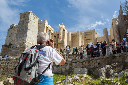 ATHENS, GREECE - MARCH 27 , 2014 : Tourists in famous old city Acropolis Parthenon Temple. Its construction began in 447 BC in the Athenian Empire. It was completed in 438 BCのeditorial素材