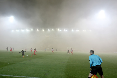 THESSALONIKI, GREECE APRIL 16, 2014 : Smoke all over the stadium during the Greek Cup Semi Final match PAOK vs Olympiacosのeditorial素材