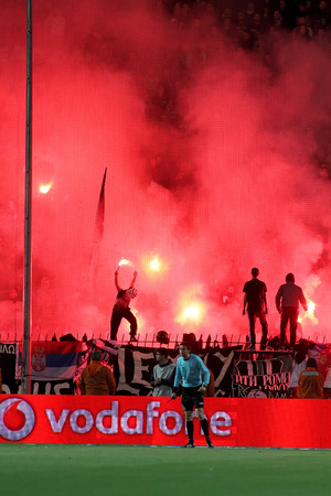 THESSALONIKI, GREECE APRIL 16, 2014 : Fans and supporters of PAOK light flares during the Greek Cup Semi Final match PAOK vs Olympiacosのeditorial素材