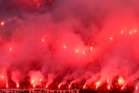 THESSALONIKI, GREECE APRIL 16, 2014 : Fans and supporters of PAOK light flares during the Greek Cup Semi Final match PAOK vs Olympiacosのeditorial素材