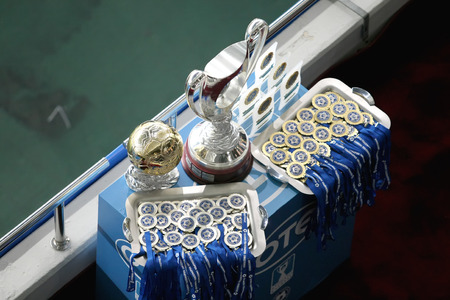 ATHENS, GREECE APRIL 26, 2014 : The Greek Cup, the MVP Cup, the Golden and Silver Medals on the table during the Greek Cup Final match Paok vs Panathinaikosのeditorial素材