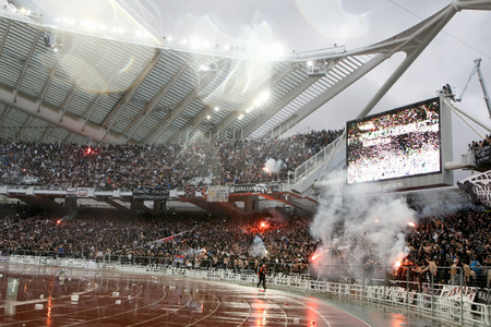 ATHENS, GREECE APRIL 26, 2014 : Paok fans and supporters light flares during the Greek Cup Final match Paok vs Panathinaikosのeditorial素材