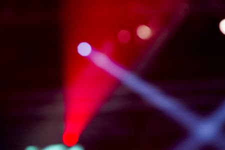 Defocused entertainment concert lighting on stage, bokeh.