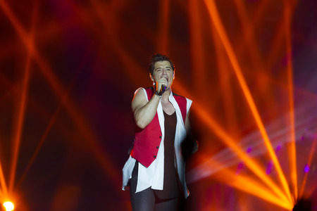 THESSALONIKI, GREECE, MAY 8 2014: Sakis Rouvas performing live on stage for the Ace of Heart tour at Sports arena in Thessaloniki.のeditorial素材