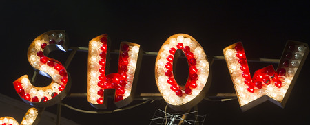 Red and yellow neon sign of the word の写真素材