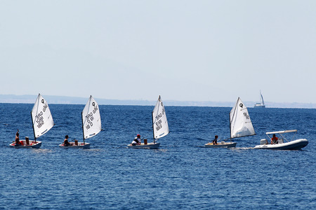 THESSALONIKI, GREECE- AUGUST 12, 2011: Offshore sailing school sailing with small boats, beginning their lesson and practicing onboard in Thessaloniki, Greece. のeditorial素材