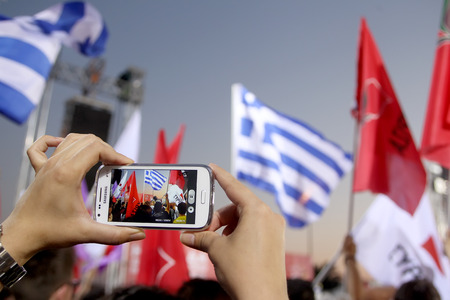THESSALONIKI, GREECE - MAY 21, 2014: Phone recording Alexis Tsipras leader of Syriza party giving...