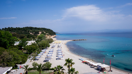 HALKIDIKI, GREECE- MAY 26, 2014: Top view of beach with tourists, sunbeds and umbrellas at a luxury hotel. Sea travel destination in Kallithea, Greeceのeditorial素材