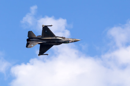KAVALA, GREECE- JUNE 21, 2014: HAF F-16 flying in the sky during the Kavala Airshow 2014, in Kavala,...
