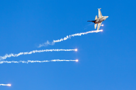 KAVALA, GREECE- JUNE 21, 2014: HAF F-16 flying in the sky during the Kavala Airshow 2014, in Kavala,...