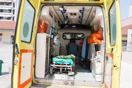 THESSALONIKI, GREECE- APRIL 24, 2013: Injured teacher in the ambulance during an earthquake exercise at 6th primary school in Thessaloniki, Greece.のeditorial素材