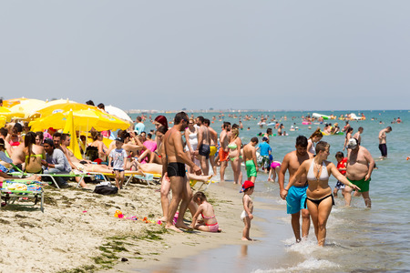 KATERINI, GREECE- JULY 6, 2014: Very Crowded Beach Full Of People At Katerini Beach, in Greece. Katerini is a popular destination famous for the beaches.のeditorial素材