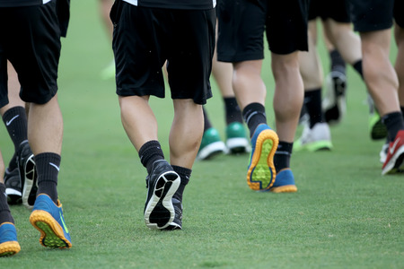 THESSALONIKI, GREECE- AUGUST 14, 2014 : Footballers feet while running before the friendly match Paok vs Inter.のeditorial素材