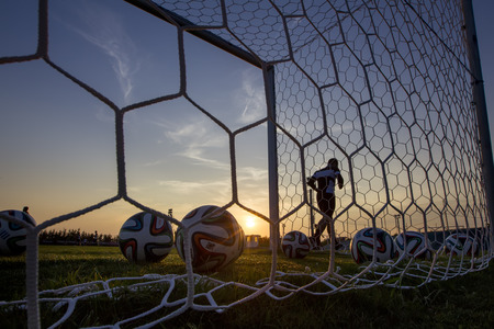 THESSALONIKI, GREECE  AUGUST 26, 2014: Greek Superleague Brazuca (Mundial) balls in net during Paok training in Thessaloniki, Greece.のeditorial素材