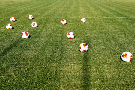 THESSALONIKI, GREECE  JUNE 30, 2014: Europa League balls on the field during the training of PAOK in Thessaloniki, Greece.のeditorial素材