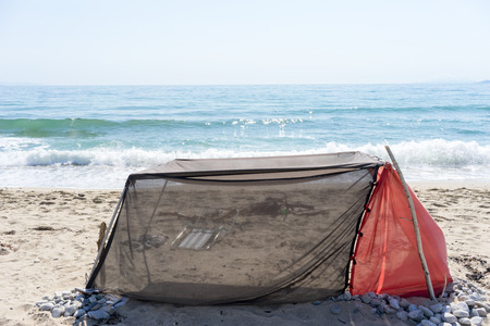 Handmade tent for shadow on a clear day at the beachの写真素材