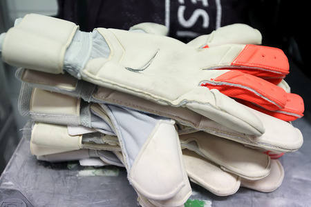 GUINGAMP, FRANCE - OCT 1, 2014 : Football gloves in stack before the UEFA Europa League match EA Guingamp vs Paok.のeditorial素材