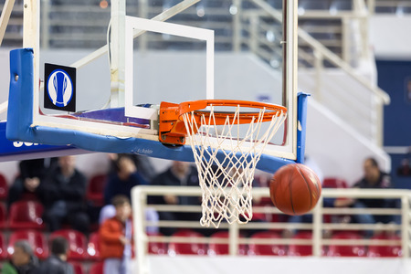 THESSALONIKI, GREECE - NOV 12, 2014: Basketball ball going through the net prior to Eurocup game Paok vs Buducnostのeditorial素材