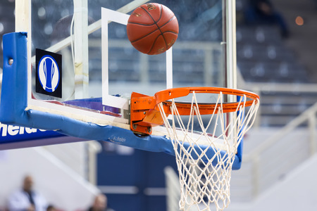 THESSALONIKI, GREECE - NOV 12, 2014: Basketball ball going through the net prior to Eurocup game Paok vs Buducnostのeditorial素材