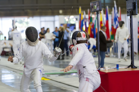 THESSALONIKI, GREECE - OCT 19, 2014 : Young athletes competing during the World Youth Fencing...