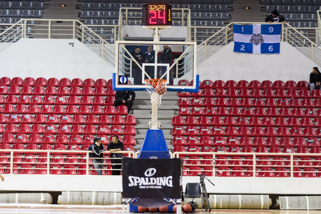 THESSALONIKI, GREECE - NOV 12, 2014: Undefined player hands throwing a ball through the net prior to Eurocup game Paok vs Budocnostのeditorial素材