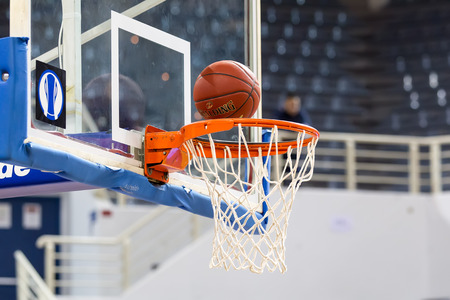 THESSALONIKI, GREECE - NOV 12, 2014: Undefined player hands throwing a ball through the net prior to Eurocup game Paok vs Budocnostのeditorial素材