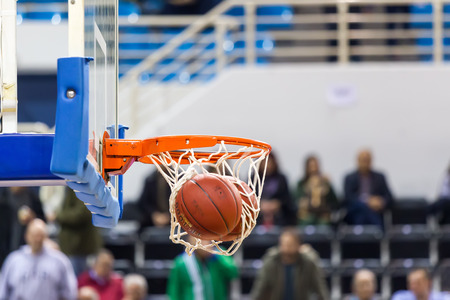 THESSALONIKI, GREECE - NOV 12, 2014: Undefined player hands throwing a ball through the net prior to Eurocup game Paok vs Budocnostのeditorial素材