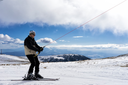 KAIMAKTSALAN, GREECE - FEBRUARY 13, 2014: Skiers enjoy the snow at Kaimaktsalan ski center, in Greece. Recently at the ski center every lift has its automatic ticketing system.のeditorial素材