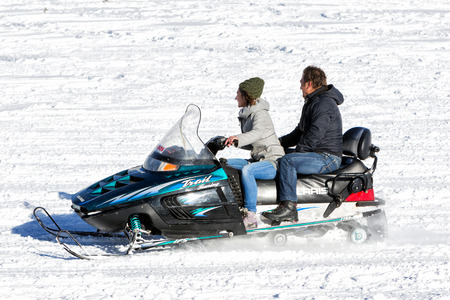 FALAKRO, GREECE - FEBRUARY 11, 2013: Visitors enjoy the snow on snowmobiles in Falakro ski center, Greece. The ski resort of Falakro Mountain is located in the area of Dramas.のeditorial素材