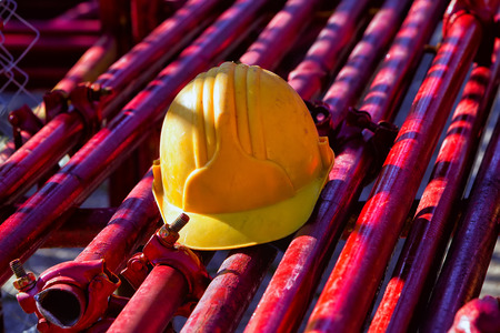 yellow hardhat on construction site