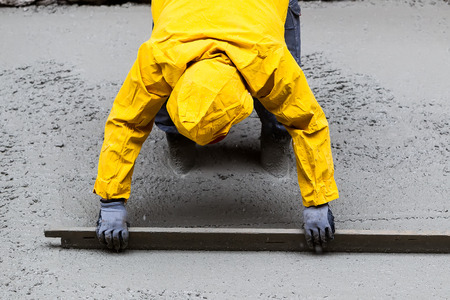 Pouring cement during sidewalk upgradeの写真素材