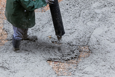 Pouring cement during sidewalk upgradeの写真素材