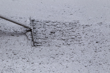 Pouring cement during sidewalk upgradeの写真素材