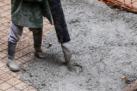 Pouring cement during sidewalk upgradeの写真素材