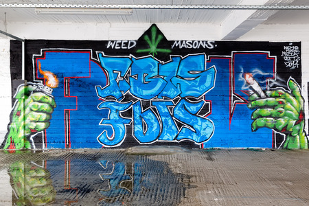 THESSALONIKI, GREECE, MARCH 23, 2015: Colorful graffiti art line the street wallsのeditorial素材