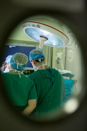 THESSALONIKI, GREECE, FEBRUARY 17, 2015: Team of doctors operates at patient in clinic centerのeditorial素材