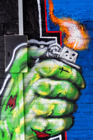 THESSALONIKI, GREECE, MARCH 23, 2015: Colorful graffiti art line the street wallsのeditorial素材