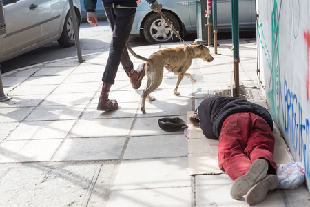 THESSALONIKI, GREECE, MARCH 28,2015: Homeless in Greece face continuing financial crisis. Homeless of Thessaloniki often begging for food or money, sleeping rough outside shops or in public parksのeditorial素材