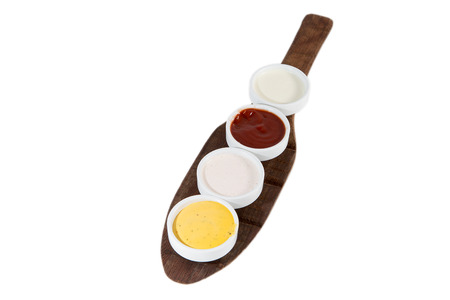 Sauces in bowls isolated on white with mustard, ketchup, yogurt and mayonnaiseの写真素材