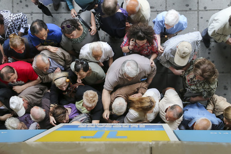 THESSALONIKI, GREECE, JULY, 1 2015: Pensioners queue outside a National Bank branch as banks only...