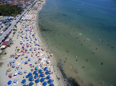 KATERINI, GREECE, JULY 5 2015: Aerial view of the beach of Katerini in Greece. colorful umbrellas and people who swims. Aerial shotのeditorial素材