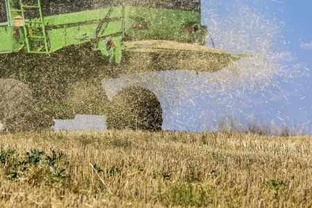 Thessaloniki, Greece - June 21, 2015: Combine harvester harvesting wheat on sunny summer day in Greeceのeditorial素材