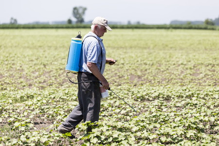 Thessaloniki, Greece - June 21, 2015: Farmer spraying cotton field in Greece.のeditorial素材