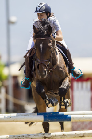 Thessloniki, Greece, June 14, 2015: Unknown rider on a horse during competition matches riding round obstaclesのeditorial素材