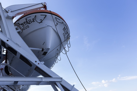 Santorini, Grece- May 12, 2015: Lifeboat on the port side of a big cruise ship heading to Santorini island, in Greece.のeditorial素材