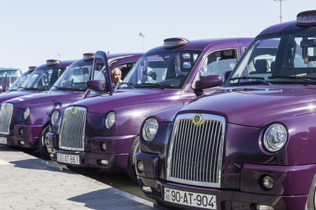 Azerbaijan, Baku - September 16, 2015: Local cabs waiting in line for passengers in Baku, Azerbaijan.のeditorial素材